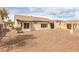 This exterior view of the home features desert landscaping and low maintenance yard at 2605 Memphis Ave, Henderson, NV 89052