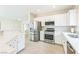 Well-lit kitchen showcasing stainless steel appliances and ample counter space at 2605 Memphis Ave, Henderson, NV 89052