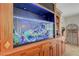 This beautiful wet bar features a built-in aquarium surrounded by cabinets and shelving for storing beverages at 2747 Paradise Rd # 501, Las Vegas, NV 89109