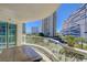 Relax on the balcony with a cozy table and chairs, offering stunning views of the city skyline and landscaped grounds at 2747 Paradise Rd # 501, Las Vegas, NV 89109