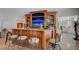 Wet bar features granite countertops, seating, custom wood cabinets, display shelving, and a built-in aquarium at 2747 Paradise Rd # 501, Las Vegas, NV 89109