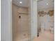 View of a bathroom with a glass door shower and toilet with gold accents at 2747 Paradise Rd # 501, Las Vegas, NV 89109