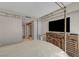 Relaxing bedroom with a four-poster bed, wooden dresser, and a television, offering a tranquil space to unwind at 2747 Paradise Rd # 501, Las Vegas, NV 89109