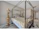 Inviting bedroom with a four-poster bed, marble floors, ornate lamps, and a glimpse into the hallway, creating a serene retreat at 2747 Paradise Rd # 501, Las Vegas, NV 89109