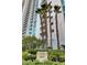 Tower 2 building view in a lush setting with palm trees, accentuating its modern architectural design and location at 2747 Paradise Rd # 501, Las Vegas, NV 89109