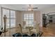 Bright dining area featuring a glass-top table, stylish chairs, and shuttered windows at 2747 Paradise Rd # 501, Las Vegas, NV 89109