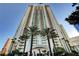 Elegant high-rise architecture with palm trees, creating a luxurious and inviting entrance in a tropical setting at 2747 Paradise Rd # 501, Las Vegas, NV 89109
