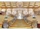 Elegant grand staircase with ornate iron railings, marble steps, and a stunning chandelier, exuding luxury at 2747 Paradise Rd # 501, Las Vegas, NV 89109