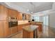 Open kitchen layout with granite counters, wooden cabinetry, and modern appliances at 2747 Paradise Rd # 501, Las Vegas, NV 89109