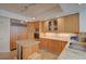 Modern kitchen featuring granite countertops, a central island, and wooden cabinets at 2747 Paradise Rd # 501, Las Vegas, NV 89109