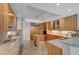 Spacious kitchen with granite countertops, stainless steel appliances, and modern wood cabinetry at 2747 Paradise Rd # 501, Las Vegas, NV 89109