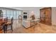Comfortable living room features a fireplace, tile flooring, and a stylish white sofa with an ornamental wood armoire at 2747 Paradise Rd # 501, Las Vegas, NV 89109
