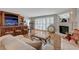 Inviting living room with tile floors, white sofa, fireplace, and bar area for entertaining guests at 2747 Paradise Rd # 501, Las Vegas, NV 89109