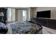 This main bedroom features a large television and an open door to the balcony at 2747 Paradise Rd # 501, Las Vegas, NV 89109