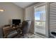 Well-lit office space featuring a desk, comfortable chair, and sliding glass doors leading to a balcony with city views at 2747 Paradise Rd # 501, Las Vegas, NV 89109