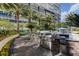 Outdoor kitchen with built-in barbeque and covered lounge area near the pool at 2747 Paradise Rd # 501, Las Vegas, NV 89109
