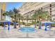 Beautiful pool with palm trees and covered lounge area for relaxing on a hot summer day at 2747 Paradise Rd # 501, Las Vegas, NV 89109