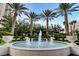 Beautiful water fountain with palm trees and lush landscaping, creating a serene and inviting outdoor space at 2747 Paradise Rd # 501, Las Vegas, NV 89109