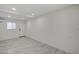 Finished basement with light gray flooring, white walls, and a window at 2839 Boise St, Las Vegas, NV 89121