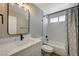 Modern bathroom with a new vanity, updated fixtures, and a subway tiled shower and tub at 2839 Boise St, Las Vegas, NV 89121