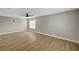 Bedroom featuring wood floors, ceiling fan, and wall art at 2839 Boise St, Las Vegas, NV 89121