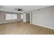 Bedroom with wood floors, ceiling fan and two windows at 2839 Boise St, Las Vegas, NV 89121