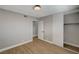 Bedroom featuring a closet with sliding doors, wood-look floors, light grey walls, and white trim at 2839 Boise St, Las Vegas, NV 89121