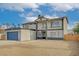 Inviting two-story home featuring a large garage, desert landscaping, and a covered front entryway at 2839 Boise St, Las Vegas, NV 89121