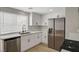 Renovated kitchen with white cabinets, stainless steel appliances, and new countertops at 2839 Boise St, Las Vegas, NV 89121