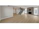 Spacious living room with hardwood floors, a brick fireplace, and large windows overlooking a pool at 2839 Boise St, Las Vegas, NV 89121