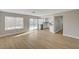 Living room with hardwood floors and large windows that lead to a view of the pool and open kitchen at 2839 Boise St, Las Vegas, NV 89121