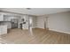 Spacious living room flows into a kitchen with stainless steel appliances and white cabinets at 2839 Boise St, Las Vegas, NV 89121