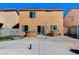 Spacious backyard with a hot tub, patio area, and ample space for outdoor entertaining and relaxation at 3193 Emerald Creek Dr, Las Vegas, NV 89156