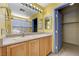 Bathroom featuring a vanity, large mirror, and a closet at 3193 Emerald Creek Dr, Las Vegas, NV 89156