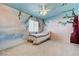 Unique bedroom with mural art, light fixture, and ample natural light at 3193 Emerald Creek Dr, Las Vegas, NV 89156