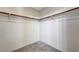Walk-in closet with a wooden hanging rod and carpet flooring at 3193 Emerald Creek Dr, Las Vegas, NV 89156