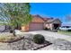 Charming single-Gathering home featuring a two-car garage and low maintenance desert landscaping at 3193 Emerald Creek Dr, Las Vegas, NV 89156