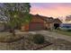 Charming single-Gathering home featuring a two-car garage and low maintenance desert landscaping at 3193 Emerald Creek Dr, Las Vegas, NV 89156