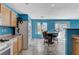 Kitchen with dining table and chairs and stainless steel appliances and lots of light at 3193 Emerald Creek Dr, Las Vegas, NV 89156