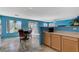 Bright kitchen that opens to the backyard with stainless steel appliances and dining table at 3193 Emerald Creek Dr, Las Vegas, NV 89156