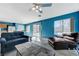Spacious living room featuring a ceiling fan and ample seating, perfect for Gathering gatherings at 3193 Emerald Creek Dr, Las Vegas, NV 89156