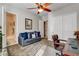 Bedroom with a ceiling fan, bathroom access, and closet space, blending comfort and convenience at 3518 W Agate Ave, Las Vegas, NV 89139