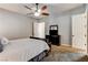 Comfortable bedroom with soft carpet, ceiling fan, and classic dark wood dresser at 3518 W Agate Ave, Las Vegas, NV 89139