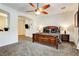 Spacious bedroom with carpet, a ceiling fan and access to the main bedroom at 3518 W Agate Ave, Las Vegas, NV 89139