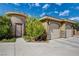 Tasteful exterior featuring a circular turret entry, and a tandem two-car garage at 3518 W Agate Ave, Las Vegas, NV 89139