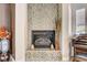 A cozy fireplace featuring decorative tiling and elegant decor at 3518 W Agate Ave, Las Vegas, NV 89139
