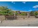 Attractive single-story house with lush landscaping behind a secure wrought iron gate at 3518 W Agate Ave, Las Vegas, NV 89139