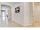 Bright hallway with tile floors and arched entries leading to living spaces at 3518 W Agate Ave, Las Vegas, NV 89139