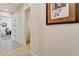 Bright hallway featuring tile floors and doorways leading to various rooms at 3518 W Agate Ave, Las Vegas, NV 89139