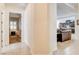 Hallway that shows a bedroom and an open living area with tile floors and light colored walls at 3518 W Agate Ave, Las Vegas, NV 89139